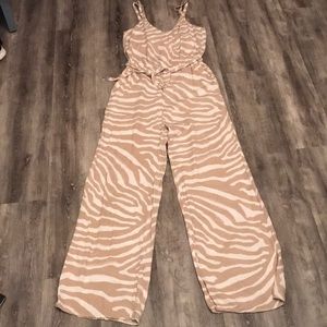 . Wide legged jumpsuit. Sleeveless with V neck